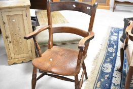 A 19th Century solid seat carver chair having rail back and turned frame