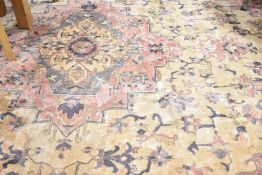 A vintage carpet square having multi colour pattern, approx 366 x 274cm (12 x 9 feet)