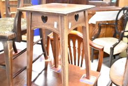 An Edwardian mahogany carver chair and a similar occasional table/plant stand