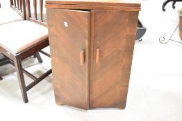 A vintage Singer treadle sewing machine, in cabinet