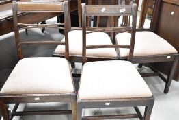A group of four 19th century design mahogany dining chairs, each of late Georgian design, two with