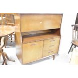A vintage sapele side cabinet having drop flap section over cupboard and drawer base, dimensions
