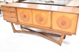 A vintage teak sideboard, similar to Nathan circles design, with drop flap, double cupboard and