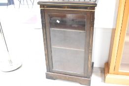A Victorian ebonised music or small display cabinet having galleried back, glazed front and gilt