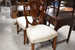 A reproduction mahogany dining chairs in the Hepplewhite style