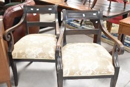 A pair of reproduction Regency design mahogany carver armchairs, having moulded top rail and slender