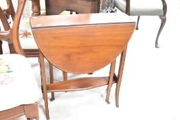 An Edwardian mahogany gateleg Sutherland style occasional table having oval top, width approx. 60cm