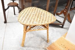 A vintage wicker side table of teardrop form, approx. W52 H47