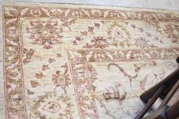 A Belgian style carpet square , having cream ground with subtle foliate design, approx. 303 x 244cm