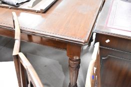 A late Victorian mahogany extending dining table, of rectangular form with moulded edge detail and