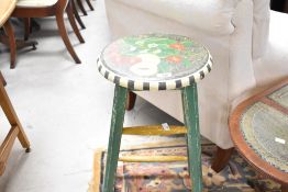 A vintage stool having hand painted fruit decoration, height approx. 69cm