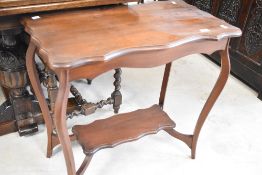 A Victorian mahogany occasional table having shaped top and undertier, approx. 72 x 40cm