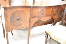 A reproduction Regency mahogany sideboard having shaped front with twin drawers to centre flanked by