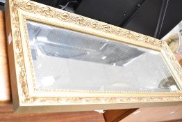 A vintage gilt frame wall mirror , hanging in portrait , approx. 71 x 31cm