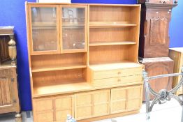 A 'Mid-Century' most likely 1970's Nathan teak room unit, with an arrangement of glazed doors,
