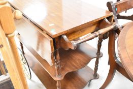 A vintage mahogany three tier tea trolley