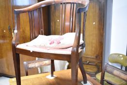 An Edwardian mahogany tub chair having rail back, and overstuffed seat (needs reupholstering)