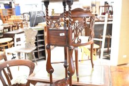 A reproduction dark stained wig/smoking stand style plant stand/occasional table, height approx.