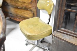 A vintage chrome framed vinyl office chair