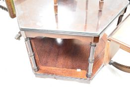 A reproduction Regency sofa style coffee table having drop flap ends and turned support on claw feet