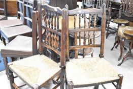 A pair of traditional rush seated ladder back chairs