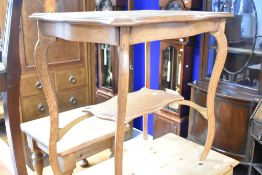 A late 19th or early 20th Century oak occasional table having shaped top and undertier, approx. 75 x
