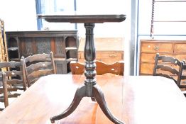 A 19th Century mahogany occasional pedestal table, the fixed rectangular top having rounded edges,