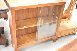 A vintage sapele low bookcase, dimensions approx. W74 H76 D24cm