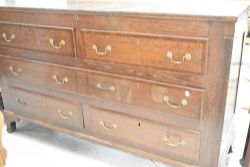 A period oak mule chest having lift lid over two faux drawers, one long drawer and three lower