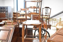 A 19th Century rustic childs correction style chair having turned frame with double stretcher,