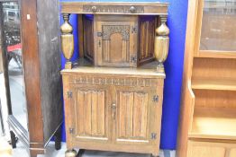 A vintage oak court cupboard, of small proportions, in the Priory style, dimensions approx. W69
