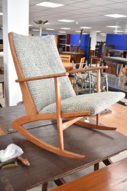 A vintage teak rocking chair of being Kubus model 97 Holgur Georg Jensen, in the boomerang style,