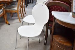 A set of four retro vintage style stacking chairs, possibly Ikea Skalsta design