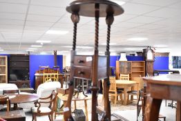 A reproduction dark stained wig/smoking stand style plant stand/occasional table, height approx.