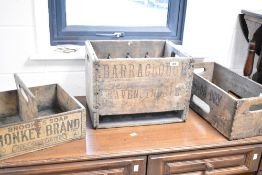 Three vintage and decorative vending crates, including Brooke's soap, Canada Dry and Barraclough,