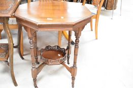 A Victorian mahogany occasional table having octagonal top and galleried undertier, width approx.