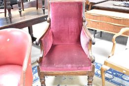 A Victorian mahogany scroll armchair , having later burgundy upholstery