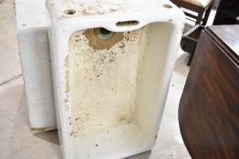 A traditional enamelled stoneware belfast sink, in some disrepair but complete and suitable as