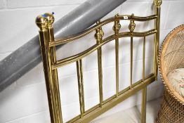 A pair of modern brass single bed headboards