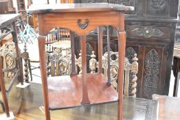 A late Victorian mahogany occasional table having shaped top , with Art Nouveau or Arts and Crafts