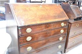 A 19th Century mahogany bureau having fall flap with fitted interior over four long drawers, width