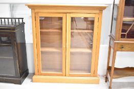 A vintage golden oak bookcase , probably joiner made, dimensions approx. W110 H120 D29cm
