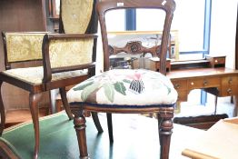 A Victorian mahogany balloon back dining chair having later upholstered tapestry seat