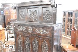 A period oak court cupboard of typical design with foliate carving throughout, dimensions approx.