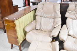 A Stressless recliner armchair and footstool in cream leather on light beech frame