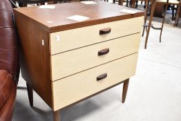 A vintage three drawer chase of nice proportions on tapered legs, drawer stamped Wrighton,