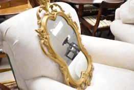 A vintage Syrocowall gilt finished resin moulded mirror, numbered 4411. approx. 79 x 49cm