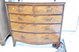 A 19th Century mahogany chest of two over three bow fronted drawers, having Regency style handles,