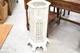 A Victorian style white painted cast iron conservatory/cathedral heater of hexagonal pierced form,