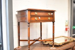A reproduction Regency occasional table having two frieze drawers, labelled internally for Brights